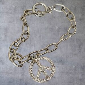 Stainless steel bracelet with paved peace sign  charm & a round toggle